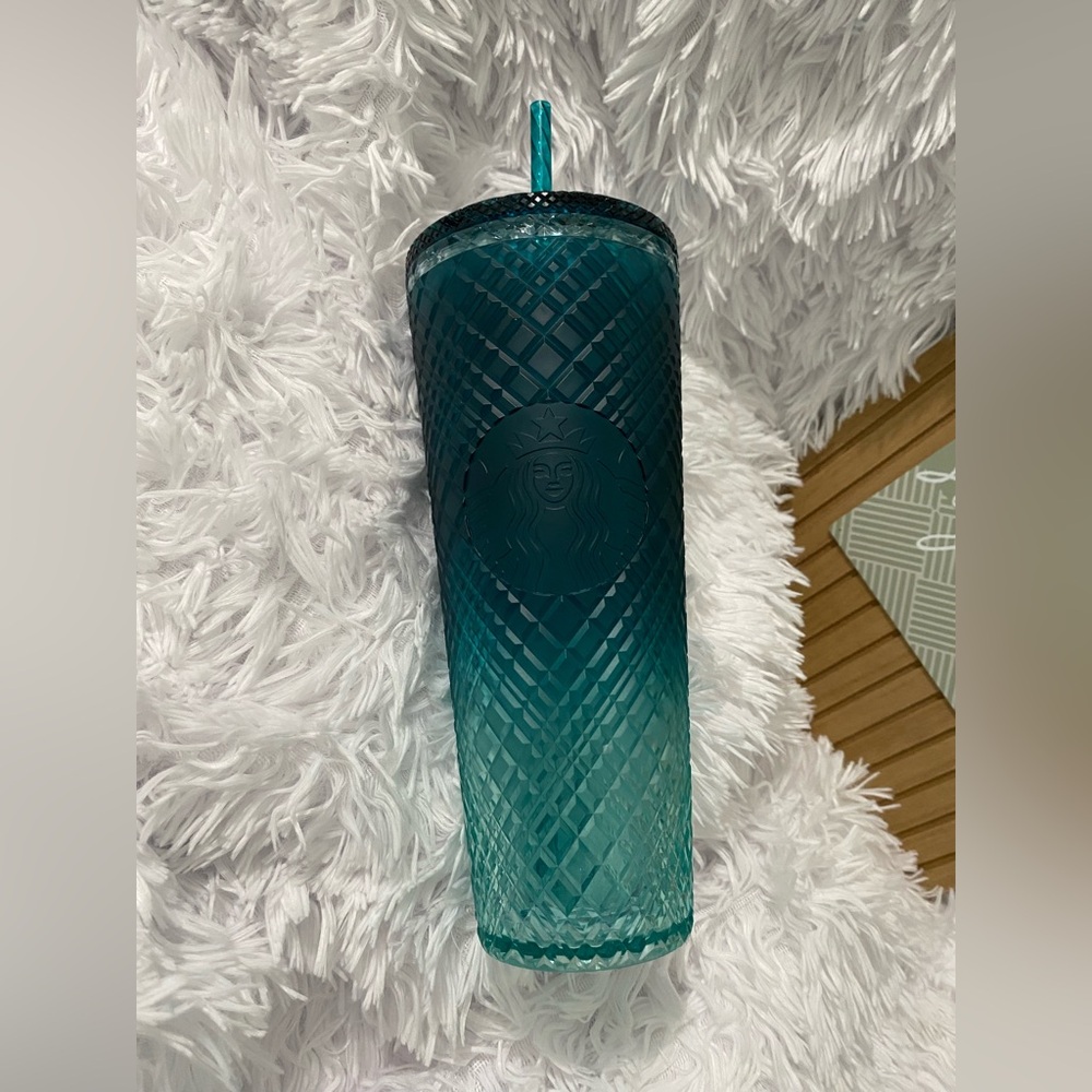 24oz turquoise Starbucks cup.